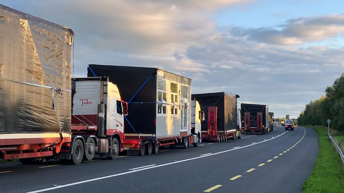 Tusker abnormal haulage convoy transporting oversized loads on the road