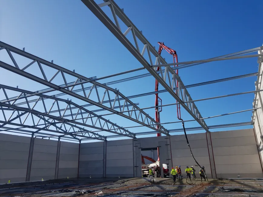Large industrial warehouse aerial view construction site