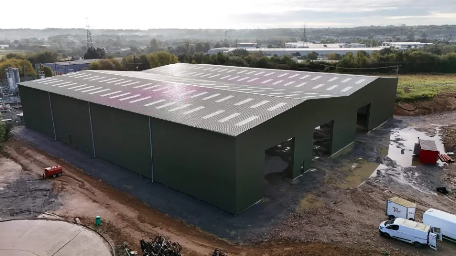 Tusker completed green steel building aerial view UK