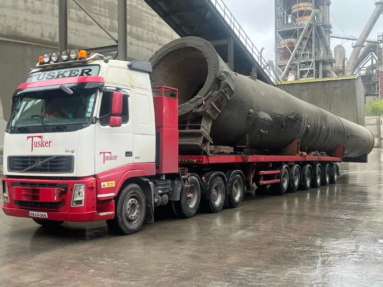 Tusker heavy load truck transporting a large industrial cylinder