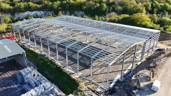 Tusker steel frame erection aerial view recycling quarry site